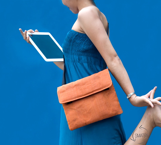 Woman with bag and tablet