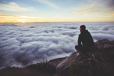 Man looking at sunset